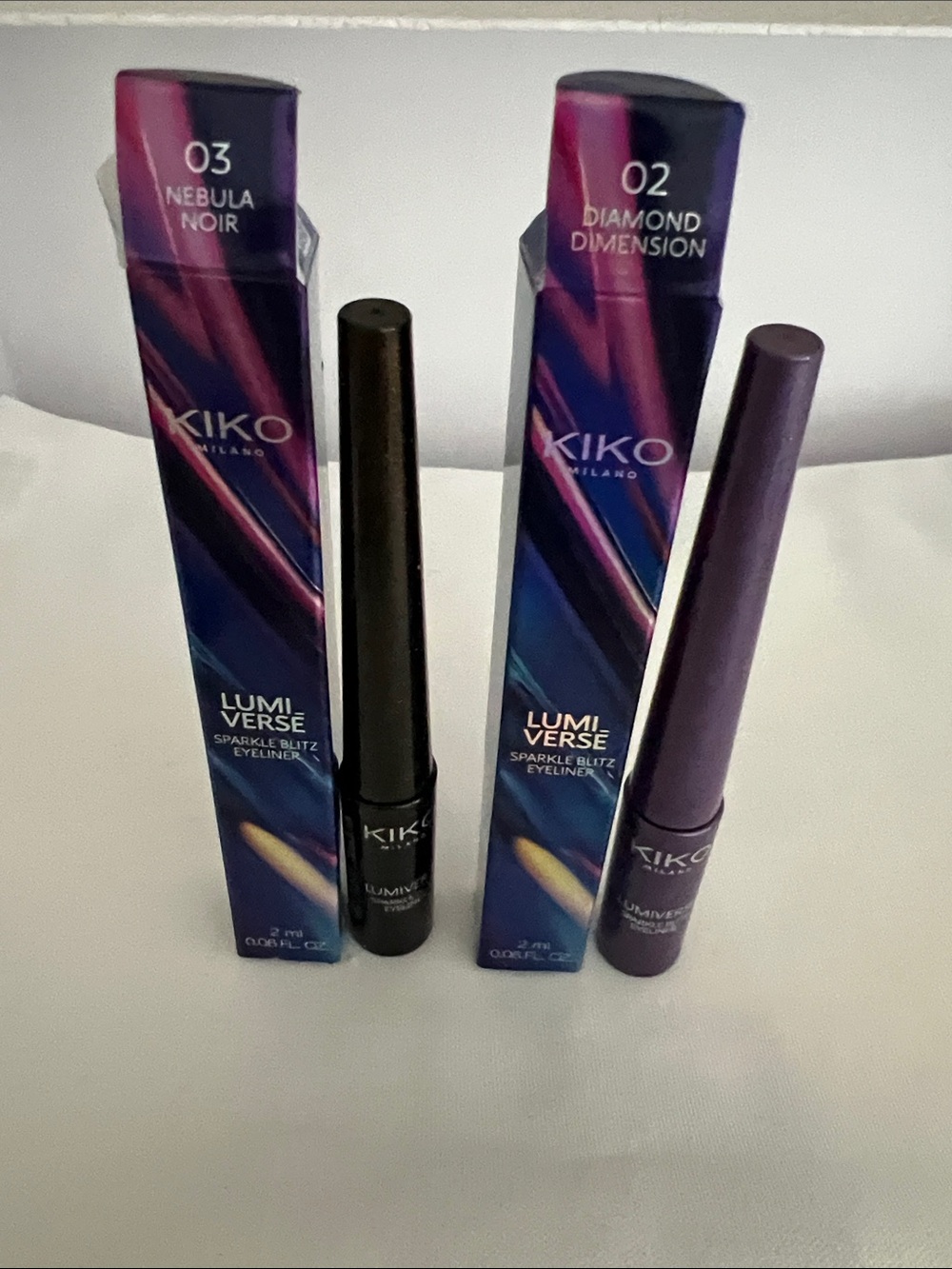 Kiko Lumiverse:Sparkle Blitz Eyeliner in 02 Diamond Dimension and 03 Nebula Noir